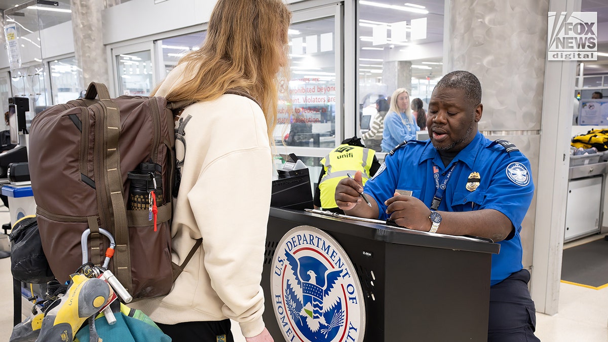 Scenes at the airport as REAL ID requirements go into effect