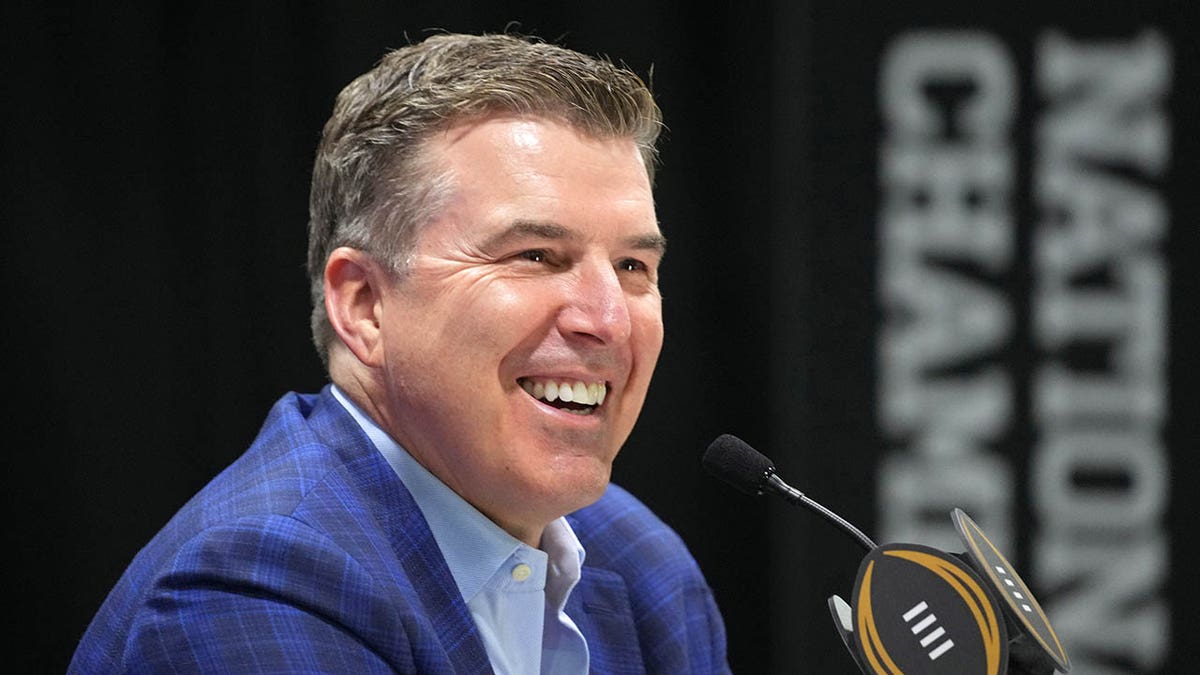 Rece Davis looks on