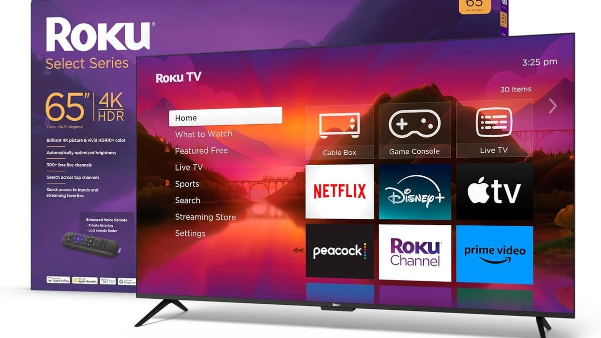 A 65 inch roku smart tv in front of its box