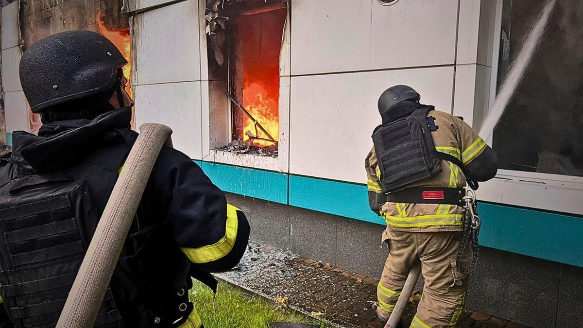 Firefighters put out a fire following Russia's drone attack in the Kyiv region on Sunday, May 18.