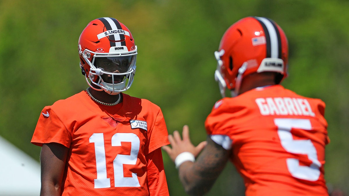 Shedeur Sanders watching Dillon Gabriel