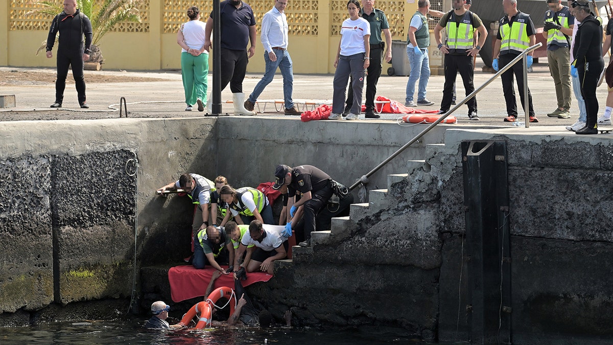 Migrants being pulled from the water in Spain
