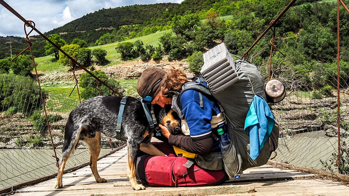 Flea-ridden puppy becomes world traveler with adventurer who had feared dogs all her life Heike Pirngruber from Heidelberg, Germany, has taken Butch the Australian Cattle puppy, under her wing and the pair have crossed multiple countries together, on foot, by canoe, motorcycle, and even by Tuk Tuk. A woman who ‘never liked dogs’ is now walking around the world with a puppy - that she found neglected and full of fleas. Heike Pirngruber, 53, has turned Australian Cattle puppy Butch into one of the best travelled dogs on the planet - vising dozens of countries. She adopted him in 2021 when he was just one month old while she was renting a beach hut in Baja California, Mexico, despite not liking dogs after being chased by them while cycling around the world for seven years.