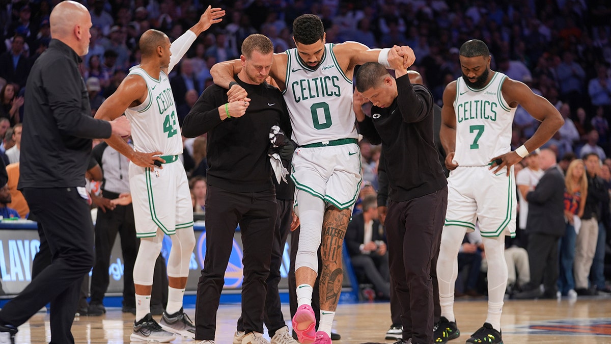 Jayson Tatum carried off
