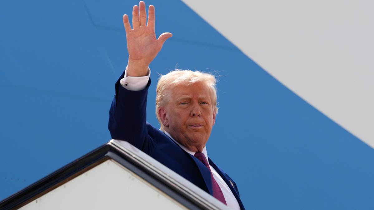 President Donald Trump waves as he boards Air Force One to depart Al Udeid Air Base on his way to the UAE on Thursday, May 15, 2025, in Doha, Qatar.