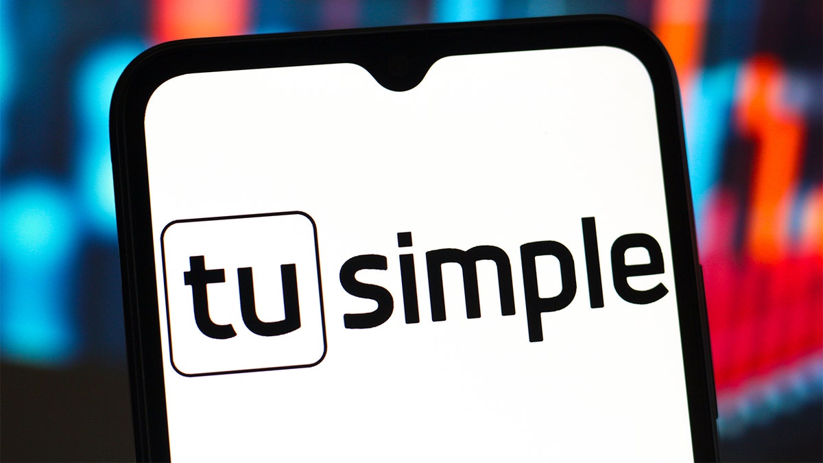 TuSimple logo on a smartphone