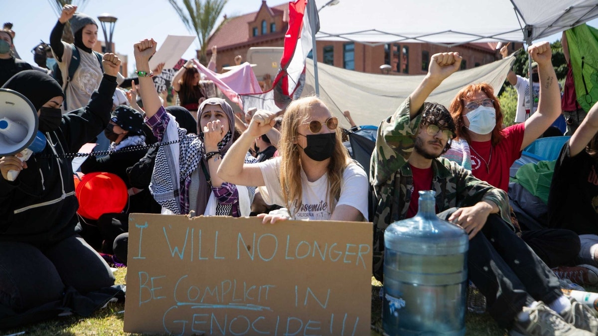 Pro-Palestinian protestors gather on the lawn in front of Arizona State University's historic Old Main building in Tempe on April 26, 2024. 