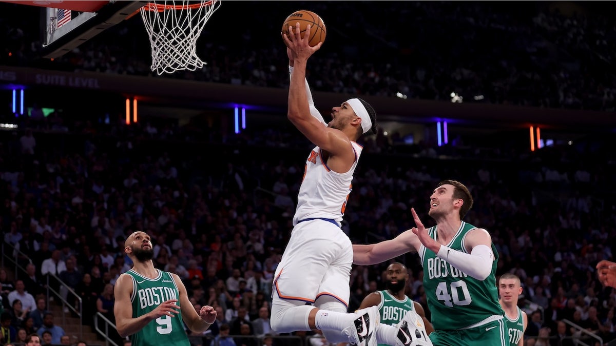 New York Knicks guard Josh Hart (3) drives to the basket against Boston Celtics guards Derrick White (9) and Jaylen Brown (7) and center Luke Kornet (40) during the second quarter of game six in the second round of the 2025 NBA Playoffs at Madison Square Garden.