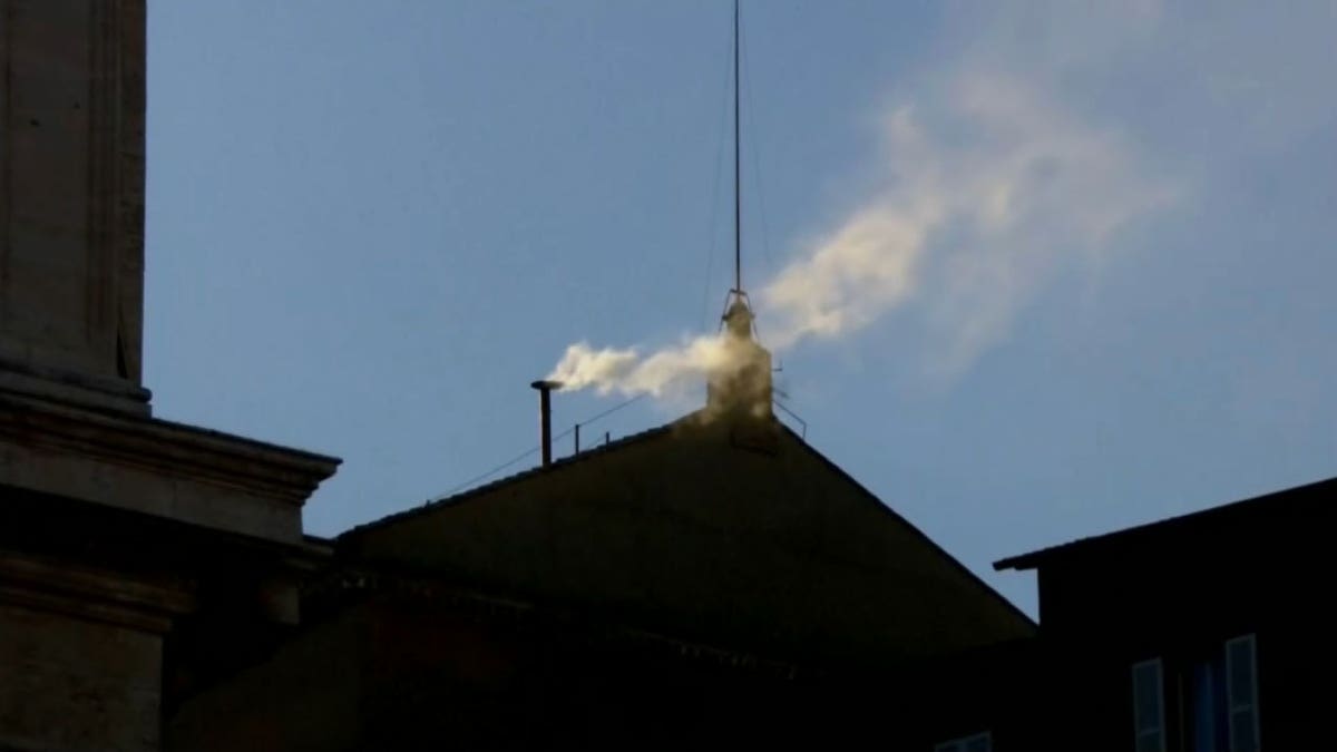 White smoke rising from the chimney.