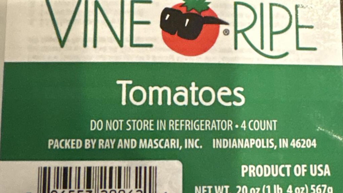 A green and white label that reads "Vine Ripe Tomatoes" is displayed.