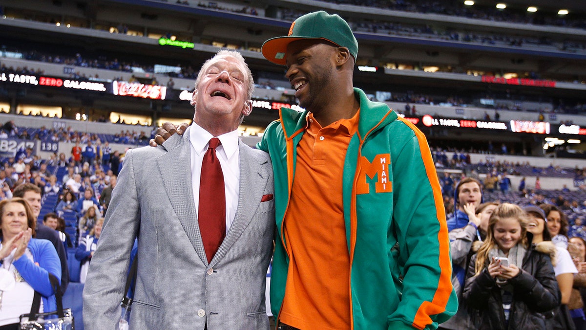 Jim Irsay and Reggie Wayne embrace