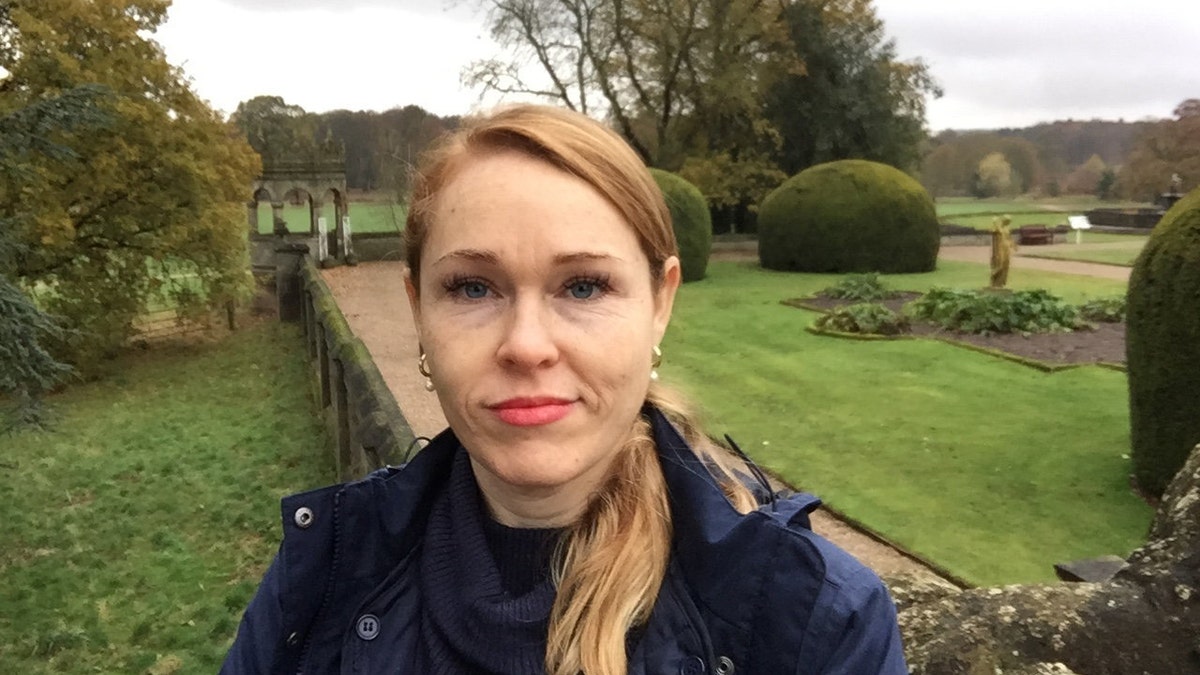 A selfie of Terrilyn Griffiths. The woman has long blonde haif and is half-smiling at the camera.