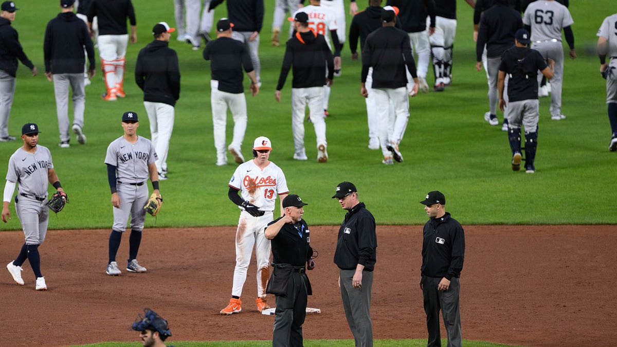 Umpires discuss benches clearing