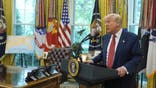 President Donald Trump speaks to reporters after David Perdue was sworn in as U.S. Ambassador to China during a ceremony in the Oval Office of the White House, Wednesday, May 7, 2025, in Washington. (AP Photo/Mark Schiefelbein)