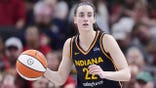 Caitlin Clark dribbles