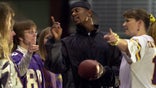 Former Viking defensive back Jack Brewer (formerly a University of Minnesota defensive back) worked with a group of audience volunteers on kickoff mechanics.