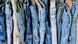 A rack of second hand jeans