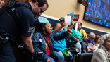 UNITED STATES - MAY 13: Demonstrators calling for preservation of Medicaid funding, are removed from the House Energy and Commerce markup of the FY2025 budget resolution in Rayburn building on Tuesday, May 13, 2025. (Tom Williams/CQ-Roll Call, Inc via Getty Images)