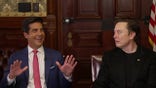 Jesse Watters laughs and holds his hands up next to Elon Musk