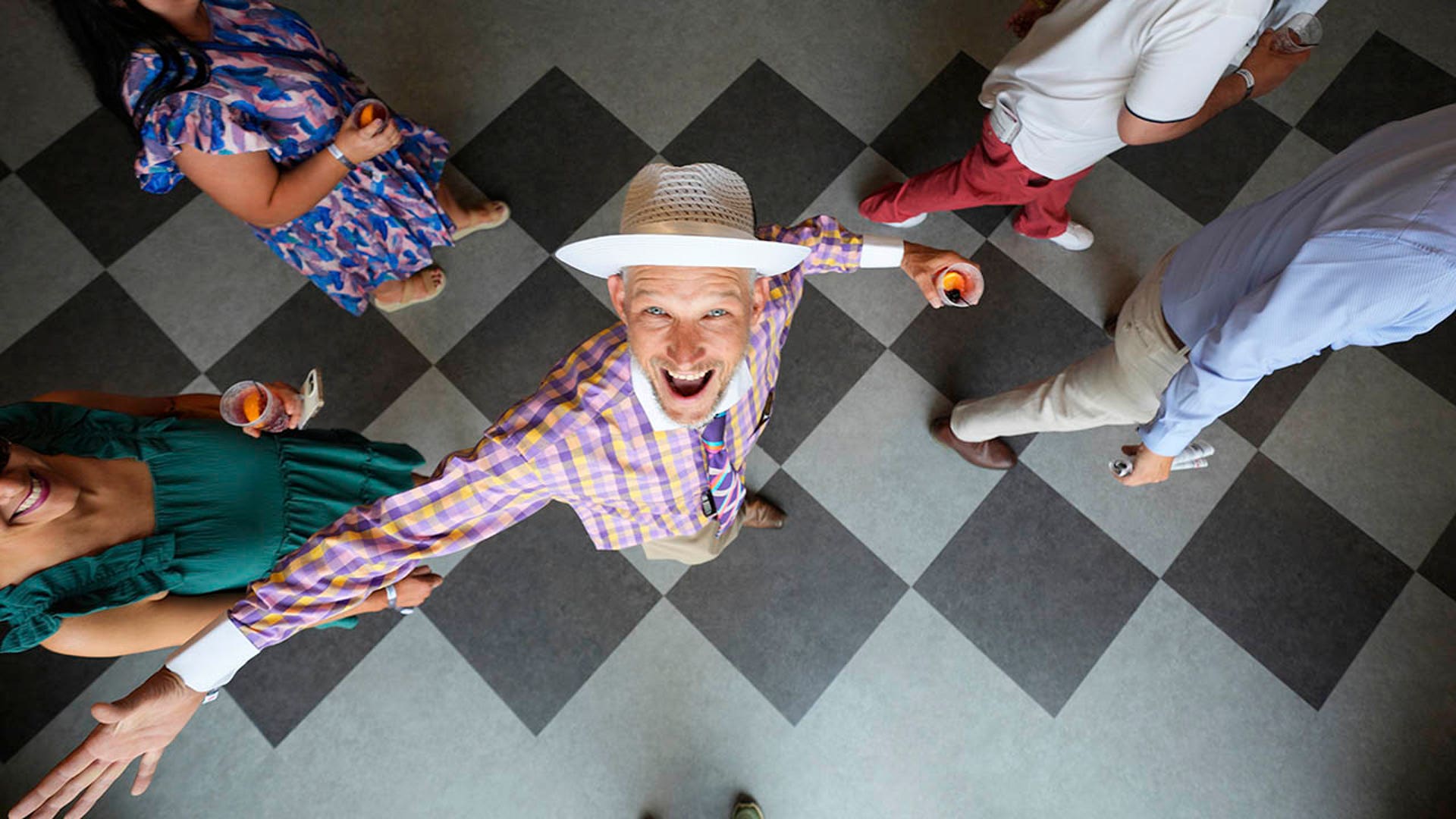 A race fan smiles at Churchill Downs