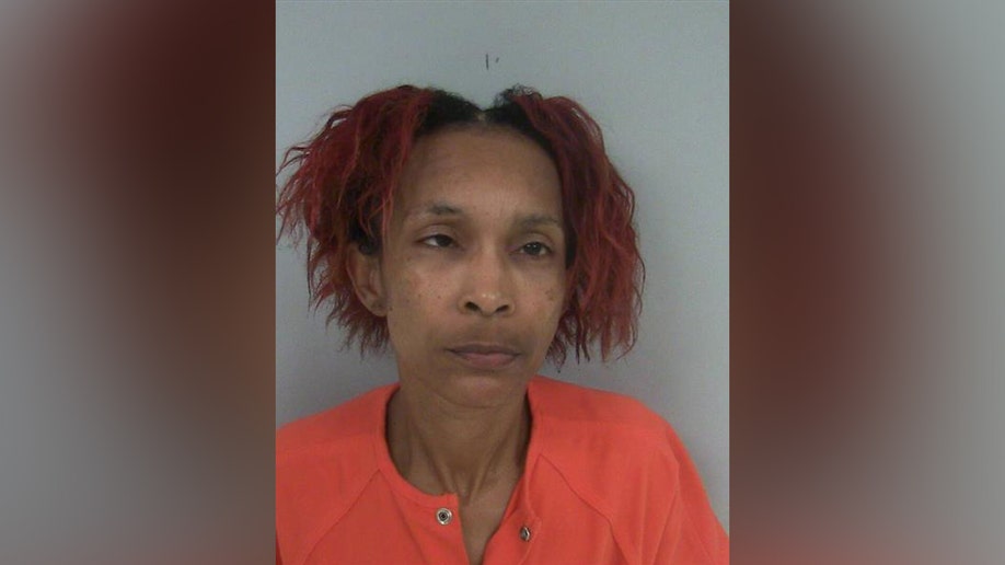 Angel McKey mugshot wearing orange prison jumpsuit