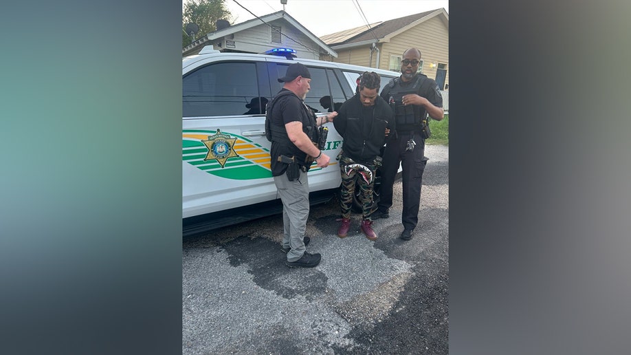 Police arresting Robert Moody
