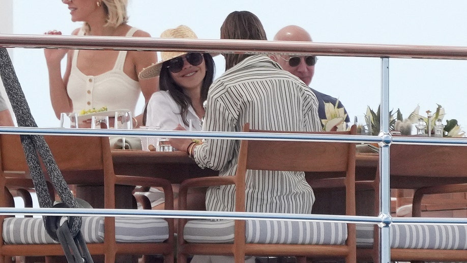 Lauren Sanchez and Jeff Bezos enjoying the food on their boat.