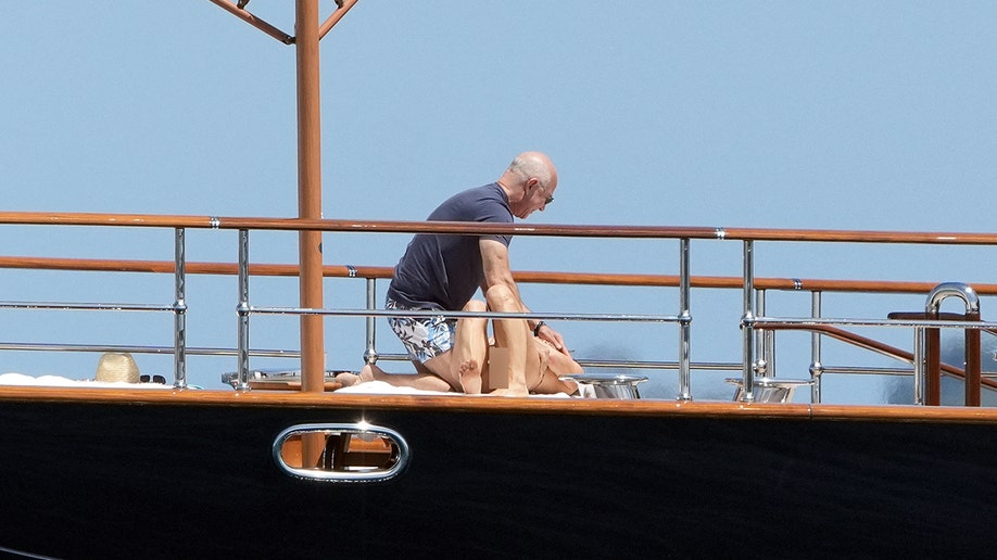 Lauren Sanchez laying down with Jeff Bezos on a boat