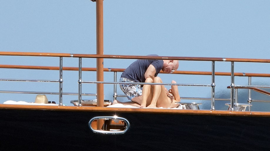 Lauren Sanchez and Jeff Bezos cuddling on a boat