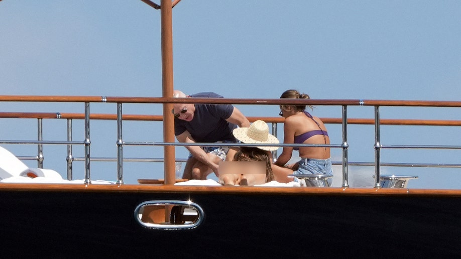 Jeff Bezos and Lauren Sanchez and a friend