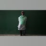 A worker looks on