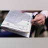A fan looks at program