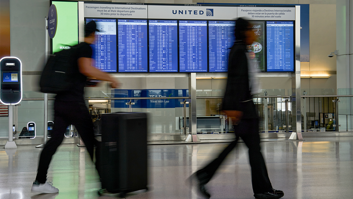 The United Airlines Holdings Inc. arrivals board at Newark Liberty International Airport (EWR) in Newark, New Jersey, US, on Tuesday, May 6, 2025.