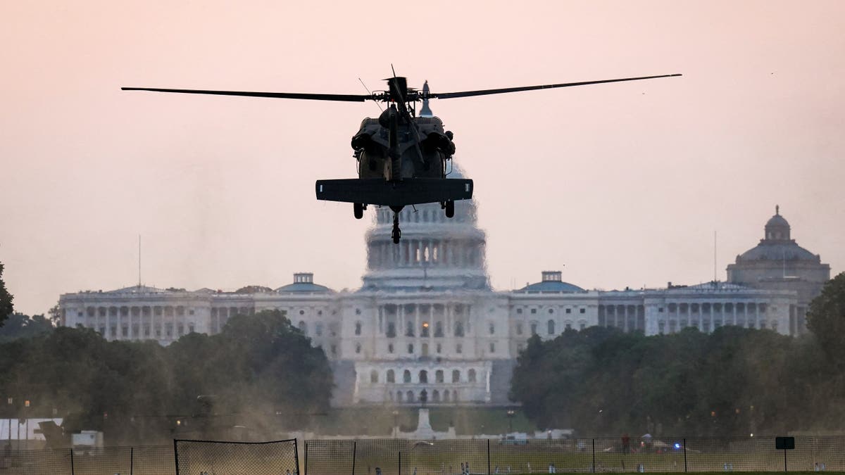 A Sikorsky UH-60 Black Hawk helicopter to be used in the U.S. Army's 250th Birthday Celebration and Parade, lands on the National Mall near the U.S. Capitol in Washington, D.C., U.S., June 11, 2025. 