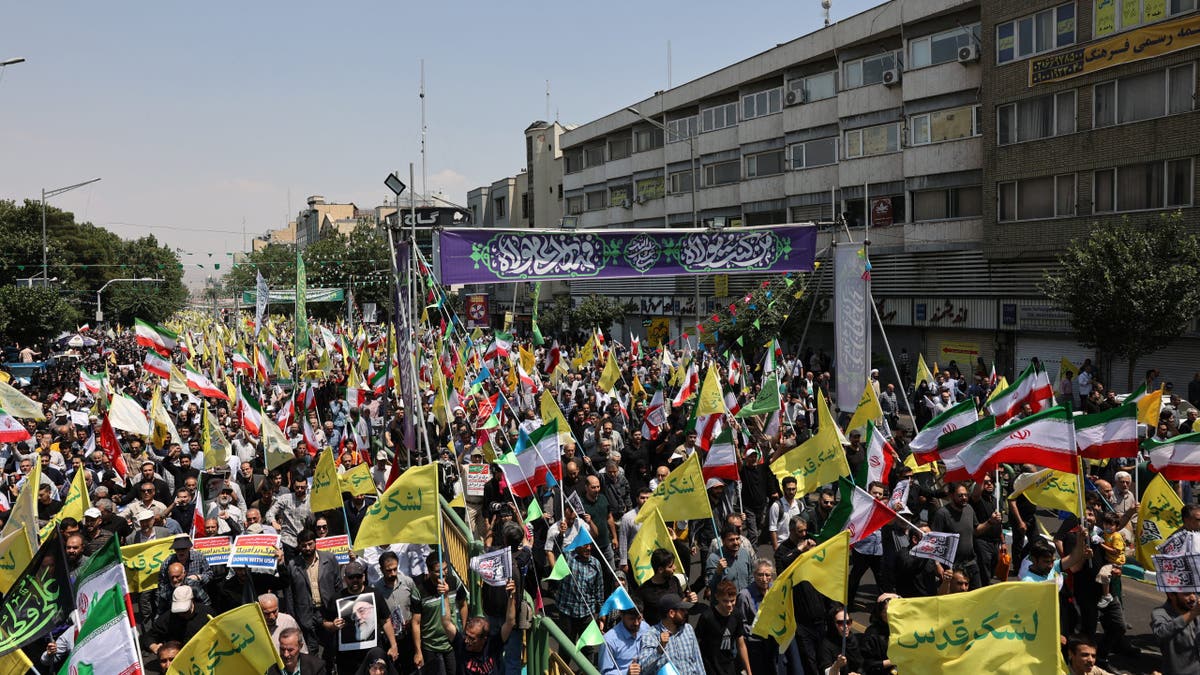 People attend an anti-Israeli protest following the Israeli strikes on Iran, in Tehran, Iran, June 13, 2025.