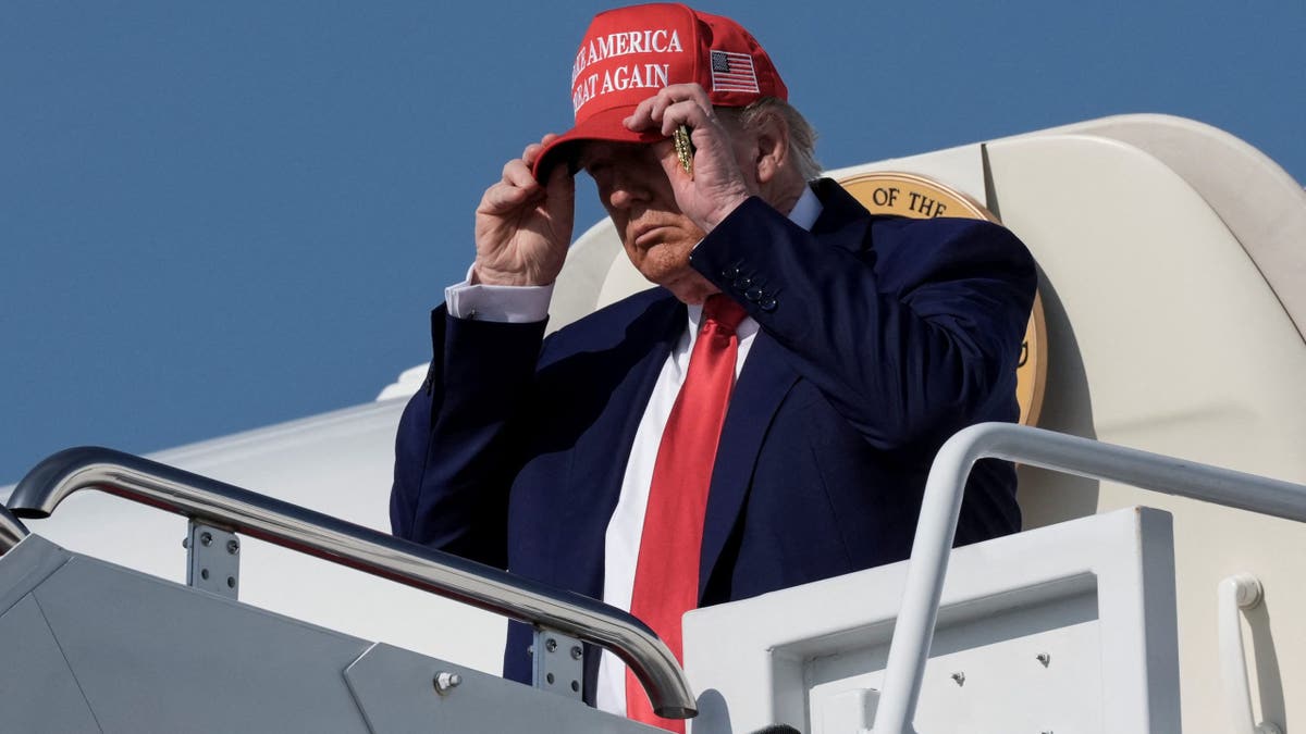 U.S. President Donald Trump disembarks Air Force One as he arrives at Joint Base Andrews, Maryland, U.S., June 21, 2025. REUTERS/Ken Cedeno