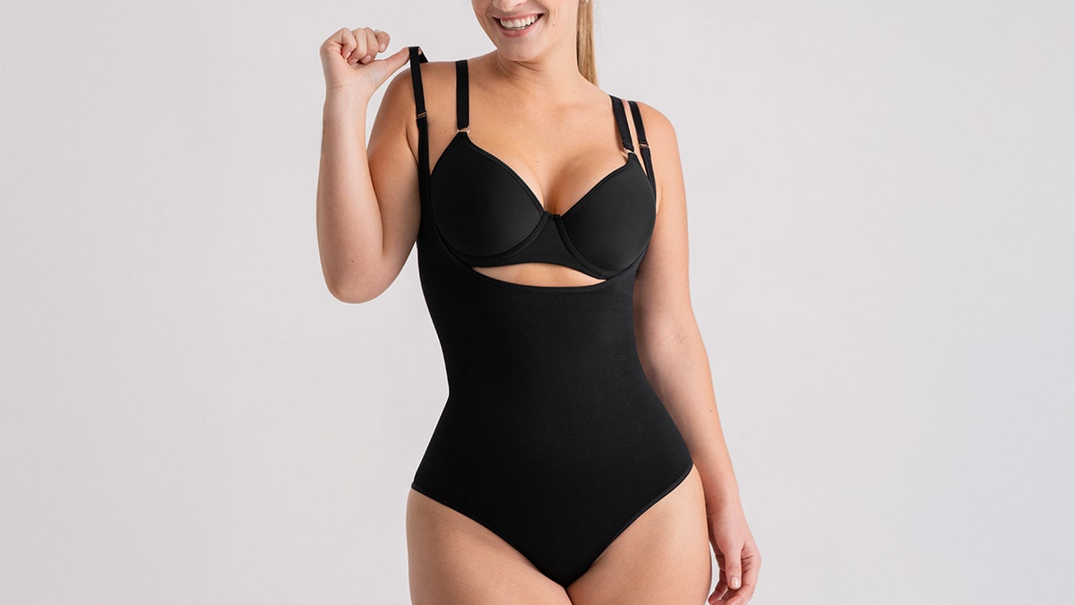 This versatile shapewear bodysuit offers a seamless tummy and backmost  smoothing effect   and its open-bust plan  allows you to W.Y.O.B. (wear your ain  bra).