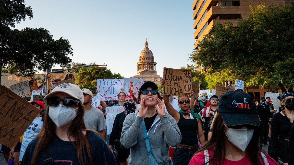 People march through downtown during an "ICE Out of Austin" demonstration on June 09, 2025 in Austin, Texas. People gathered during an emergency protest against the ongoing ICE (U.S. Immigration and Customs Enforcement) raids and deportations across Los Angeles.
