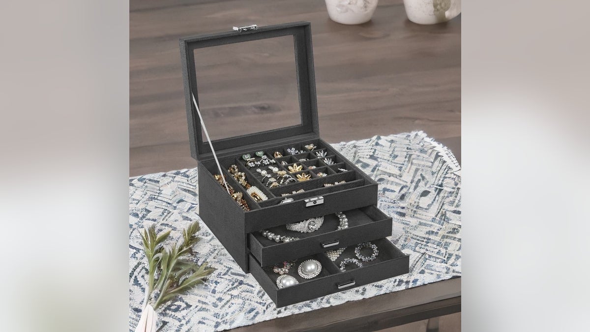 This three-tier box locks to keep valuables secure.