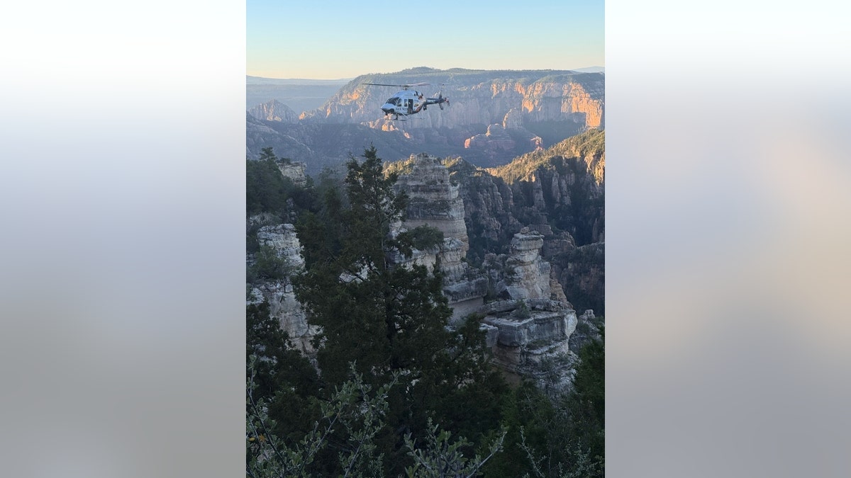 A helicopter flies over the canyon area where Janelle Banda was located