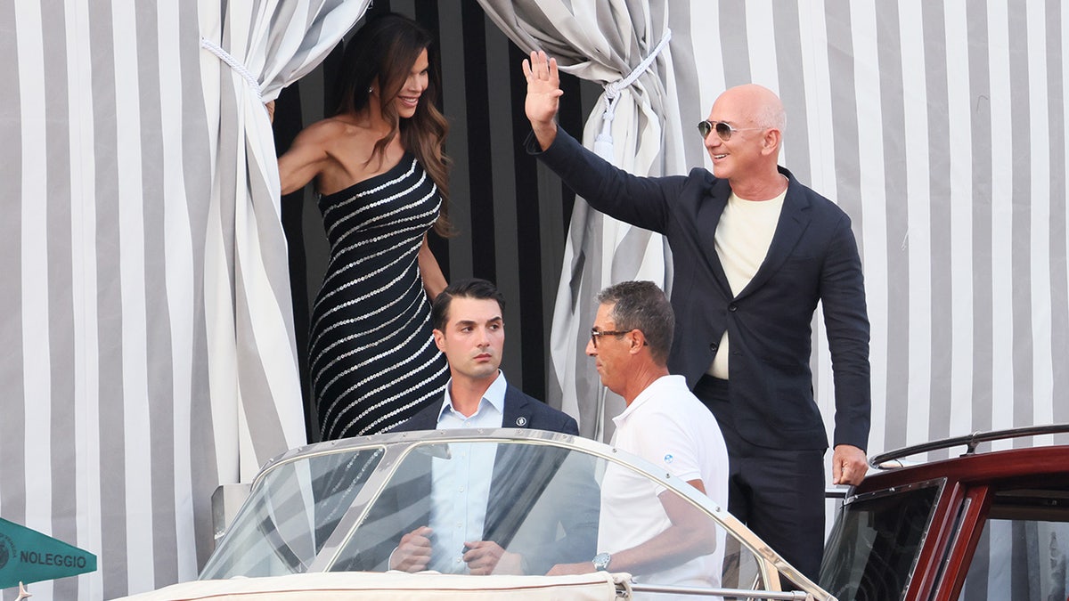 Lauren Sanchez and Jeff Bezos boarding a water taxi in Venice