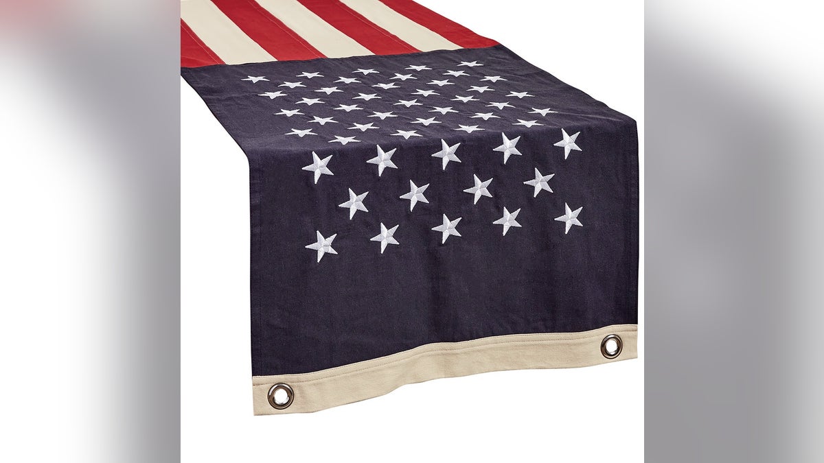 This table runner features an intricate stars and stripes pattern.