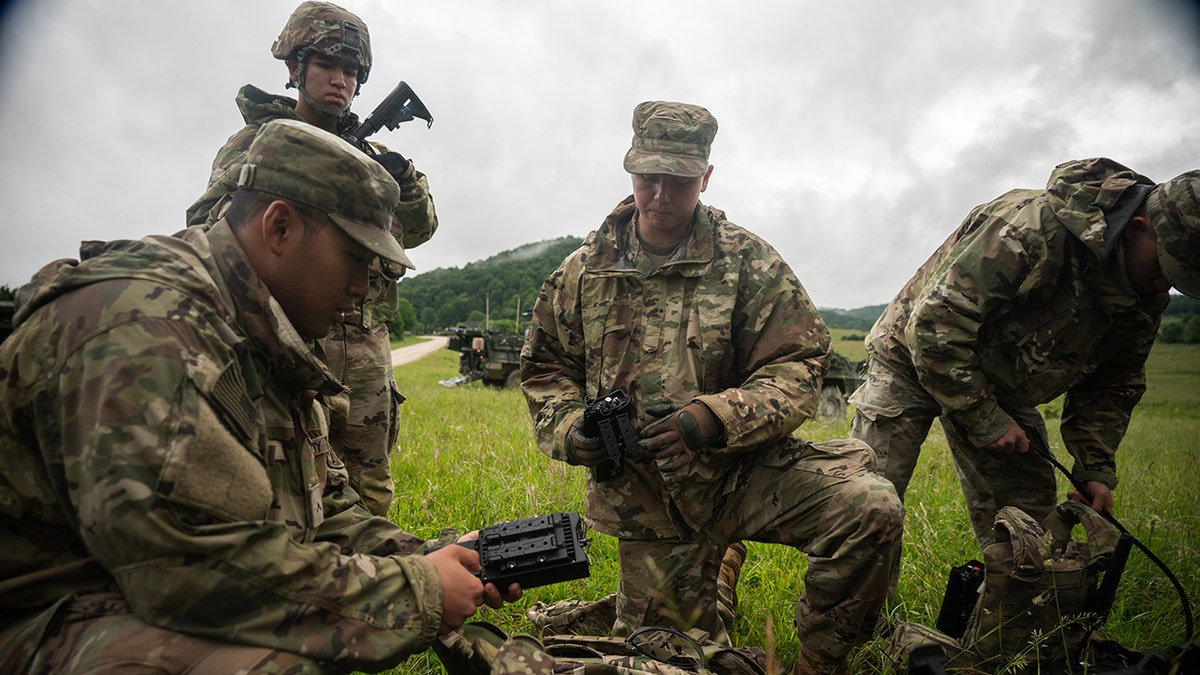 American soldiers prepared uninterrupted air system devices during Project Flytrap