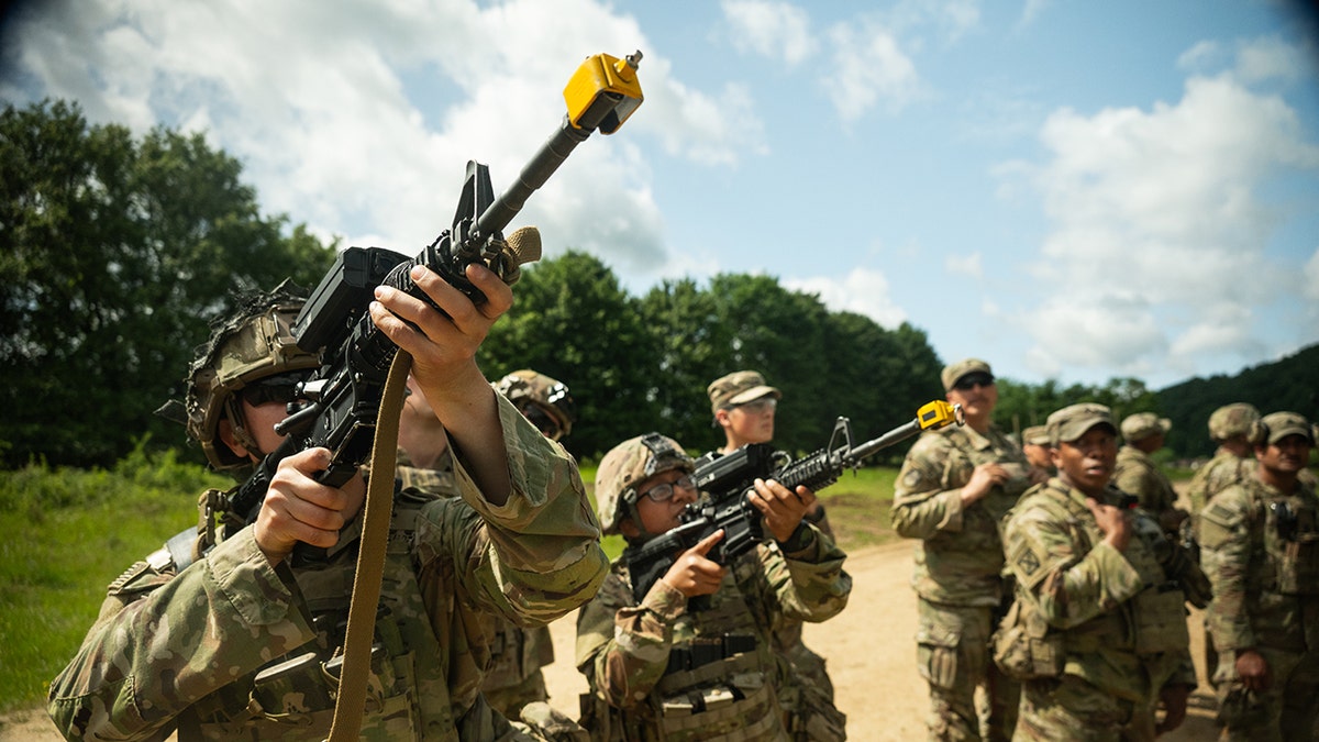A U.S. Soldier peers through the scope of a Smartshooter SMASH 2000L