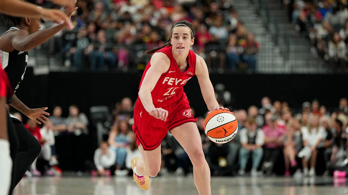 Caitlin Clark dribbles
