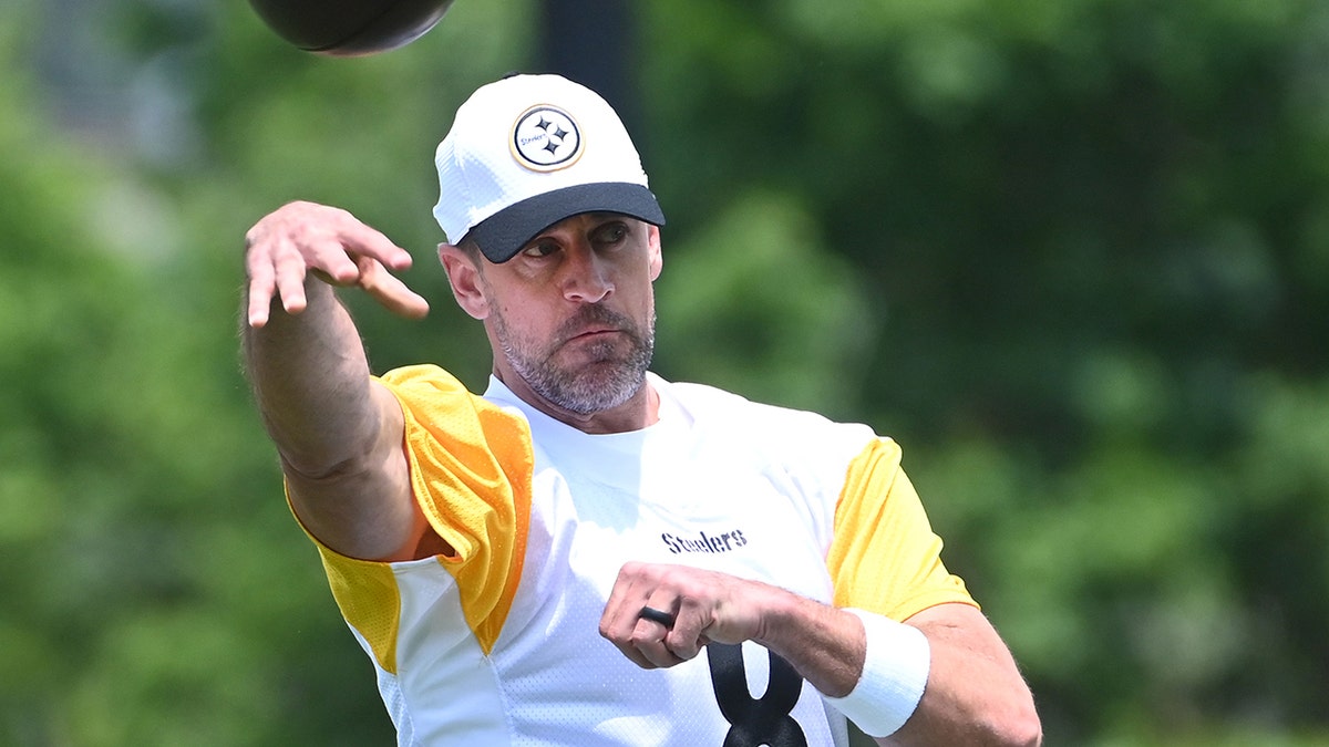Aaron Rodgers throws football