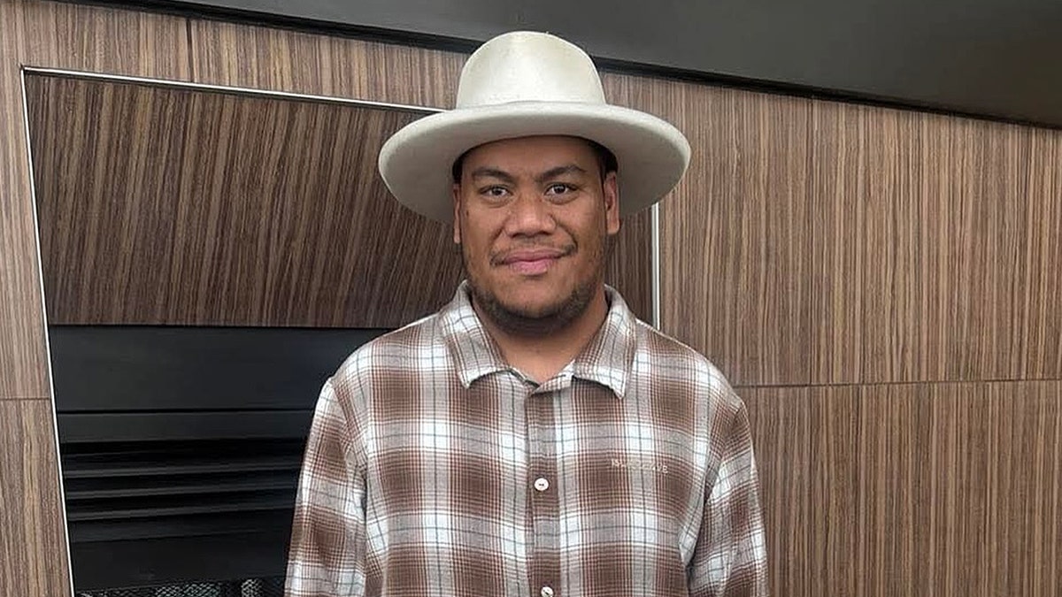 Afa Ah Loo wearing a hat
