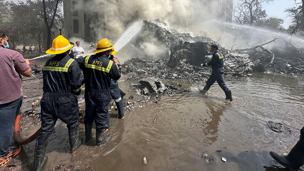 Smoke rises from Air India plane crash site