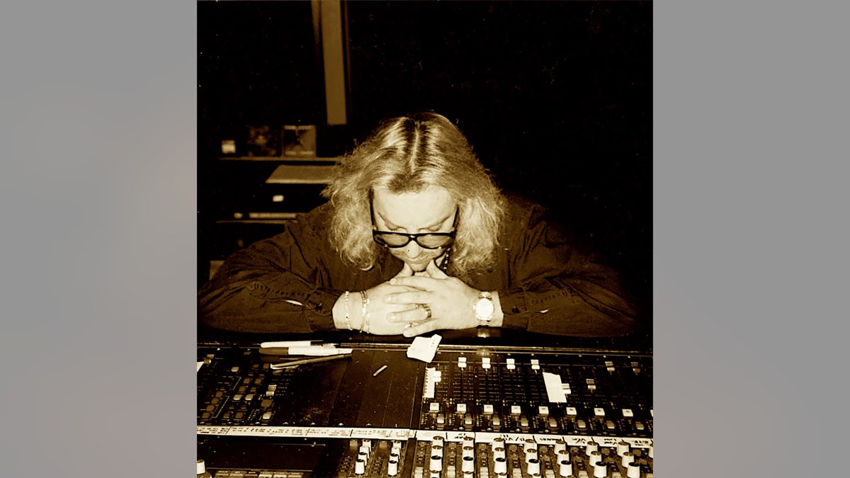 Alan Niven looking down astatine nan signaling studio.