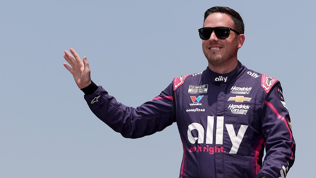 Alex Bowman waves to the crowd